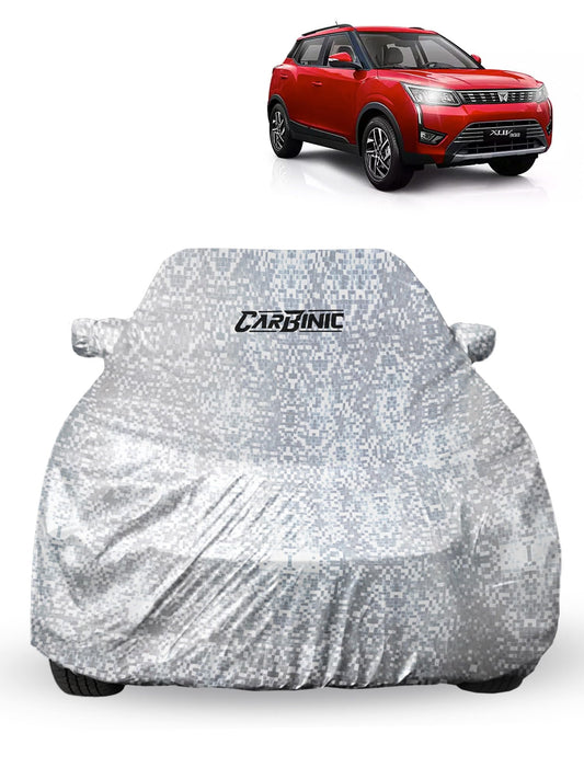 CARBINIC Car Cover for Mahindra XUV3002019 Waterproof Tested and Dustproof Custom Fit UV Heat Resistant Outdoor Protection with Triple Stitched Fully Elastic Surface  Silver with Pockets